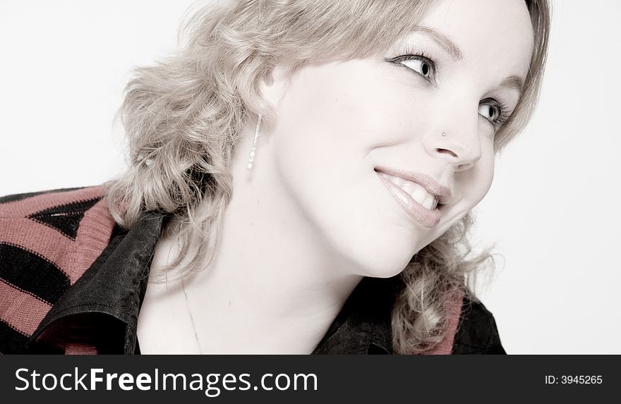 Studio portrait of a young blond curly woman looking dreamy. Studio portrait of a young blond curly woman looking dreamy