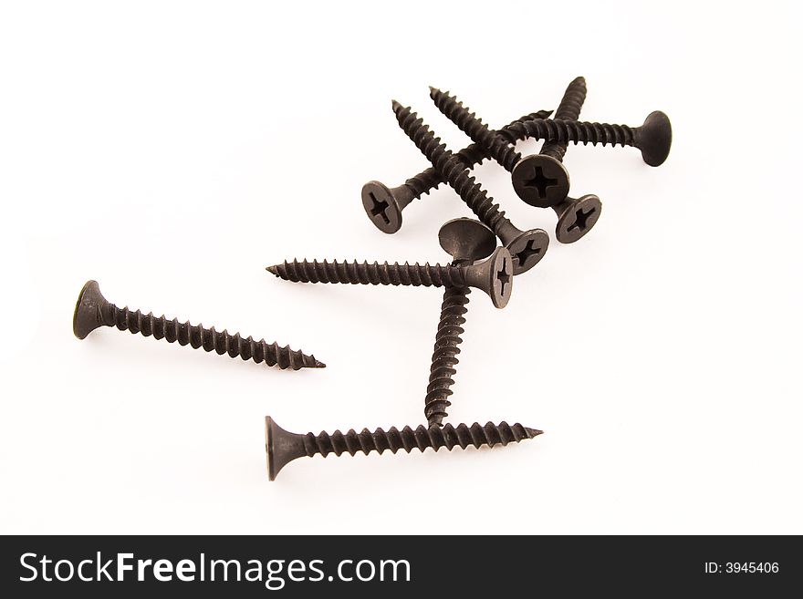 Black screws isolated on a white background