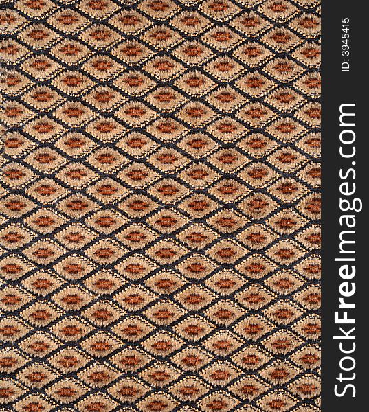 Brown fabric material texture with rhombs. Brown fabric material texture with rhombs