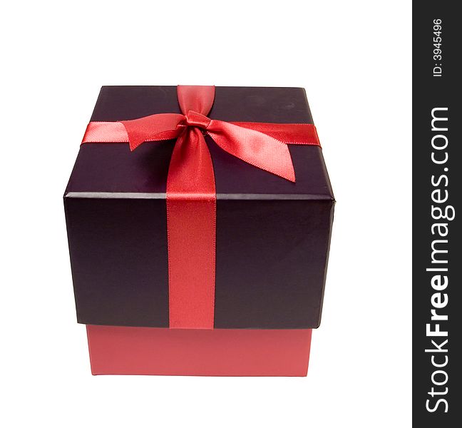 Gift box with red ribbon. Working path included. Isolated on the white background. Gift box with red ribbon. Working path included. Isolated on the white background.