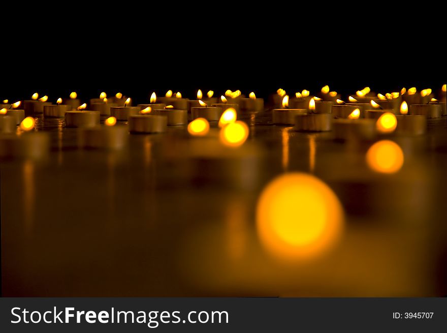 Close up view of the candles in the darkness