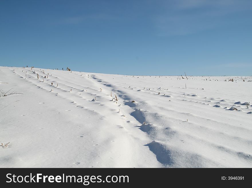 Snowy hill and sky