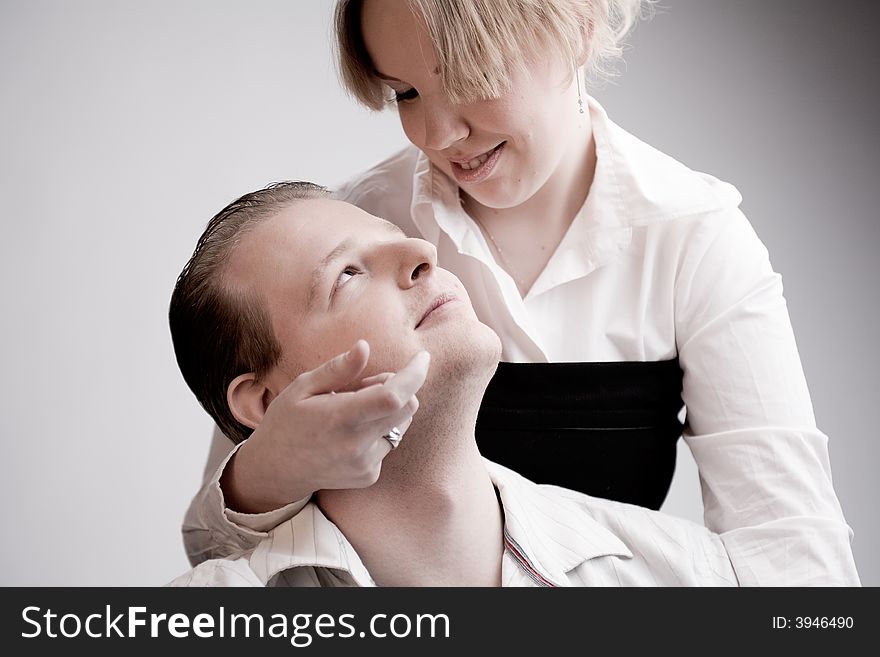 Studio portrait of a young amorous couple looking in love. Studio portrait of a young amorous couple looking in love