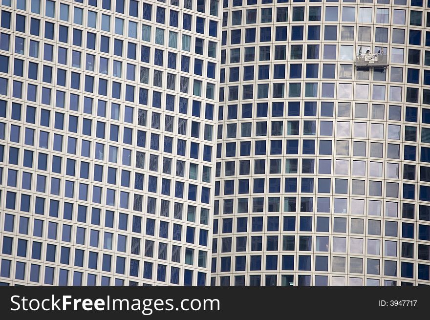 Window cleaners on a skyscraper cleaning windows
