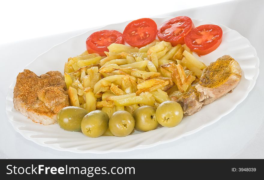 Pork chop with fried potatoes on plate. Pork chop with fried potatoes on plate