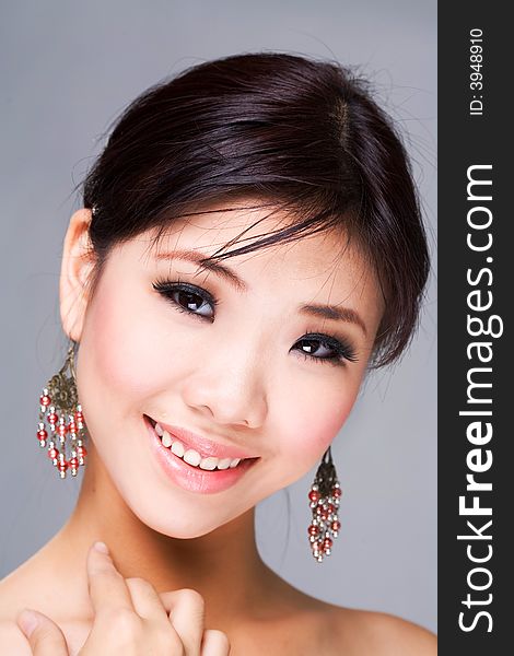 Beautiful asian woman with a sensual smile. Beautiful asian woman with a sensual smile