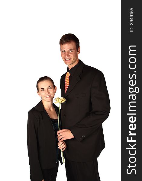 Young couple holding a flower dressed for success