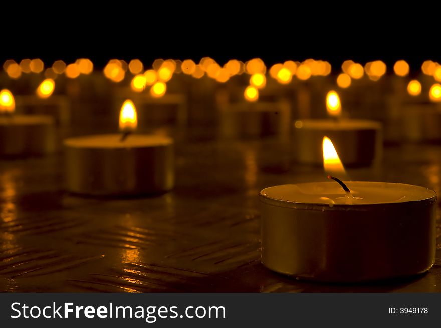 Close up view of the candles in the darkness