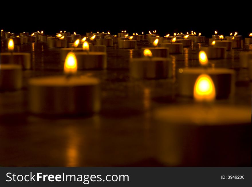 Close up view of the candles in the darkness