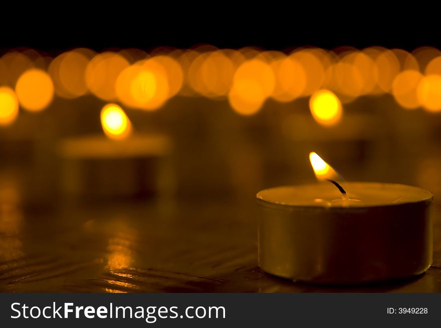 Close up view of the candles in the darkness