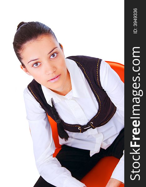 Portrait of a young business woman sitting on chair. Isolated on white background