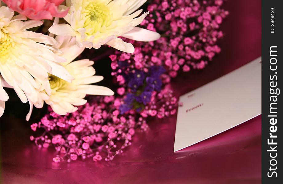 Blank card on a bouquet of flowers. Blank card on a bouquet of flowers