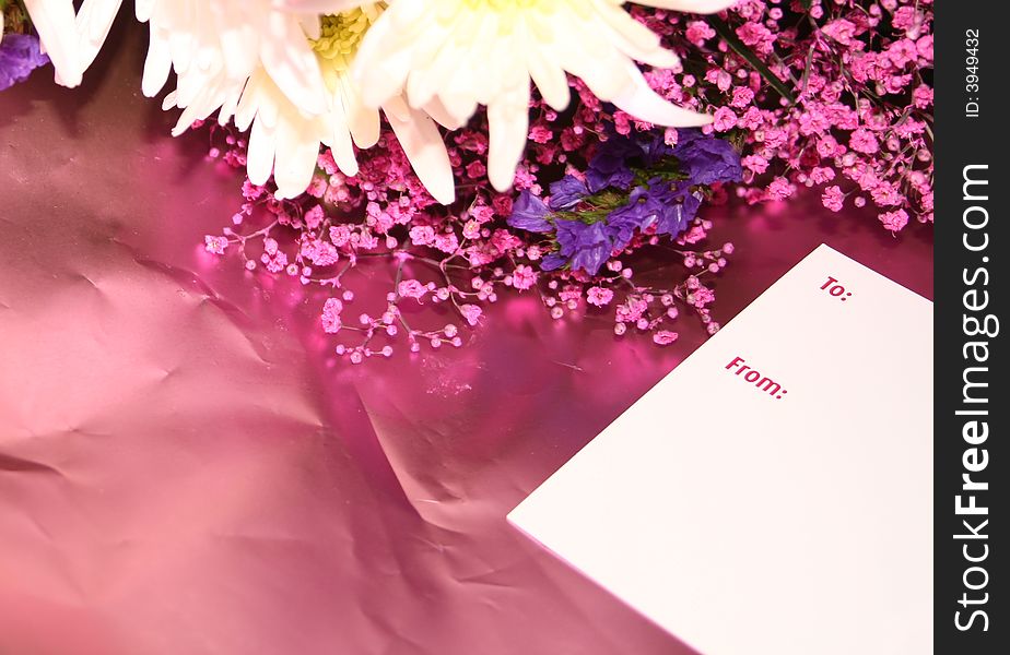 Blank card on a bouquet of flowers with a card. Blank card on a bouquet of flowers with a card