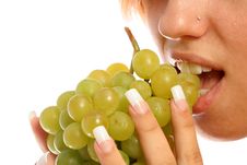 Girl With A Cluster Of Green Grapes Stock Photography