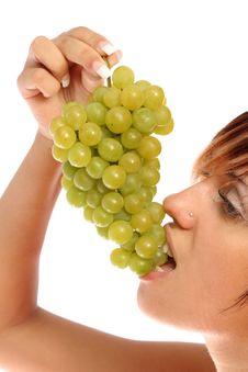 Girl With A Cluster Of Green Grapes Stock Image