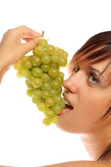 Girl With A Cluster Of Green Grapes Stock Images