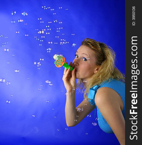 Beautiful blond girl with soap bubbles. Beautiful blond girl with soap bubbles