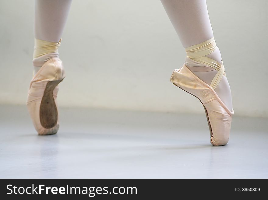Ballerina on pointe with pointeshoes side by side