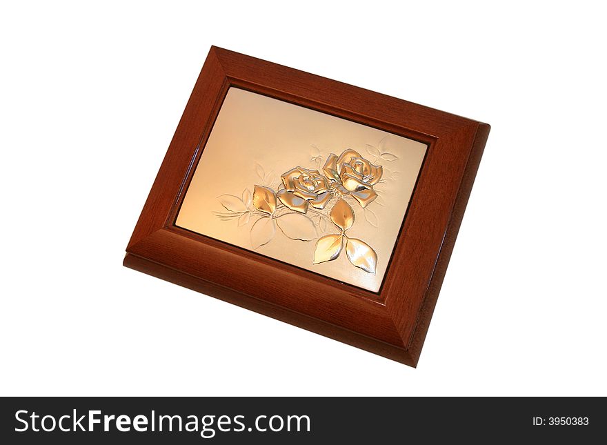 Jeweller ornament in a wooden casket. It is isolated on a white background