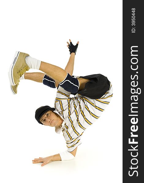Young bboy standing on one hand. Holding legs in air. Looking at camera. Isolated on white in studio. Front view, whole body. Young bboy standing on one hand. Holding legs in air. Looking at camera. Isolated on white in studio. Front view, whole body