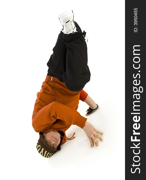 Young bboy holding up on hands and head. Holding legs in air. Looking at camera. Isolated on white in studio. Front view, whole body. Young bboy holding up on hands and head. Holding legs in air. Looking at camera. Isolated on white in studio. Front view, whole body