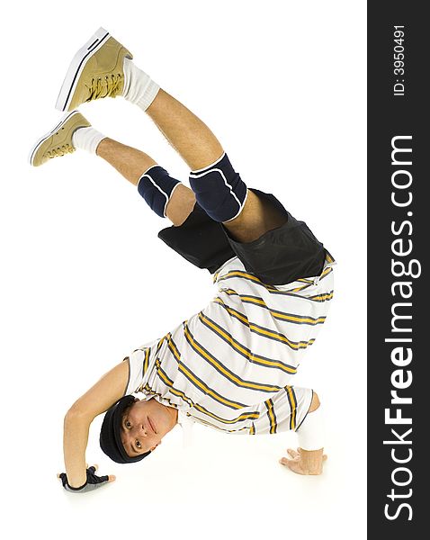 Young bboy standing on hands. Holding legs in air. Looking at camera and smiling. Isolated on white in studio. Front view, whole body. Young bboy standing on hands. Holding legs in air. Looking at camera and smiling. Isolated on white in studio. Front view, whole body