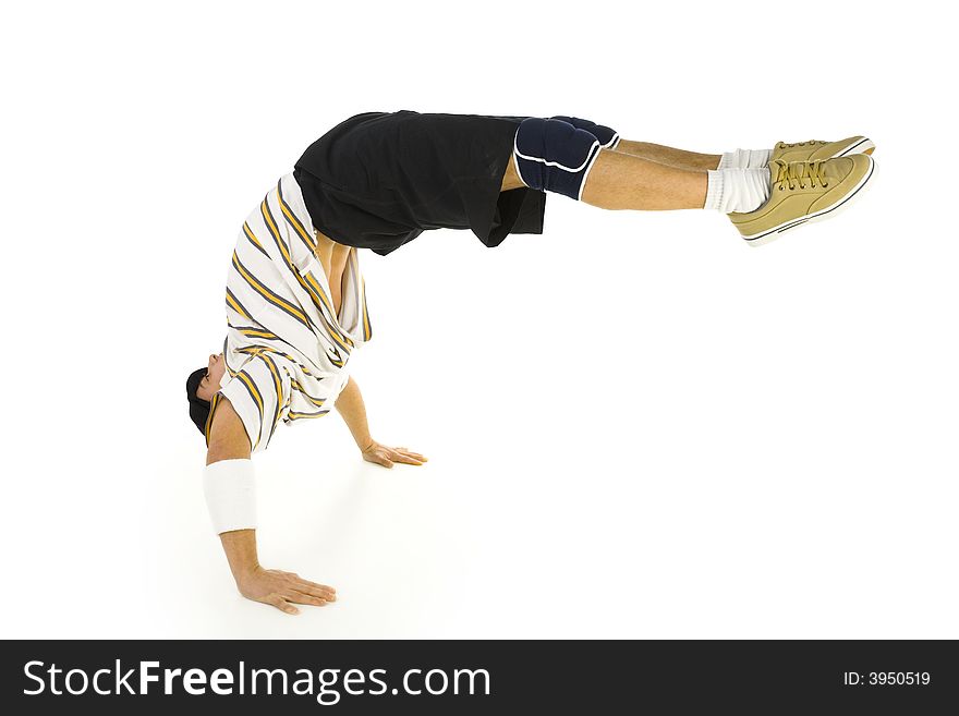 Young bboy standing on hands. Holding legs in air. Isolated on white in studio. Side view, whole body. Young bboy standing on hands. Holding legs in air. Isolated on white in studio. Side view, whole body