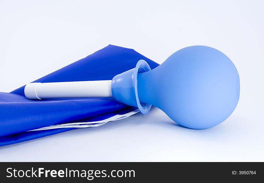 Rubber medical pear with a tip with a blue fabric on a white background. Rubber medical pear with a tip with a blue fabric on a white background