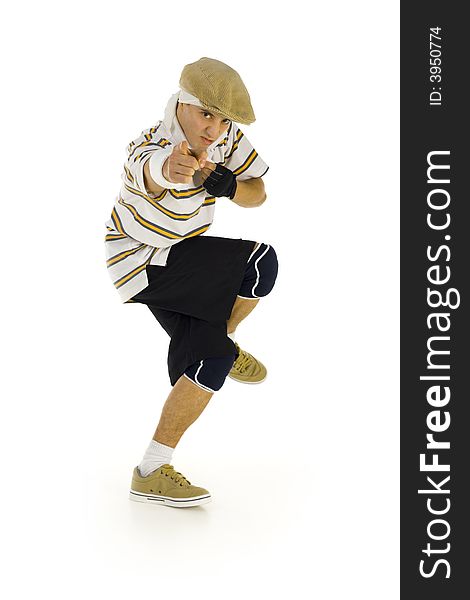 Young, angry bboy standing on one leg. Looking and pointing at camera. Isolated on white in studio. Side view, whole body. Young, angry bboy standing on one leg. Looking and pointing at camera. Isolated on white in studio. Side view, whole body