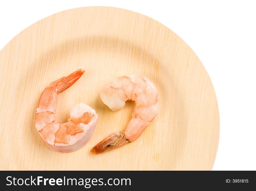 Two cooked Shrimps on an environmentally friendly bamboo plate. Two cooked Shrimps on an environmentally friendly bamboo plate