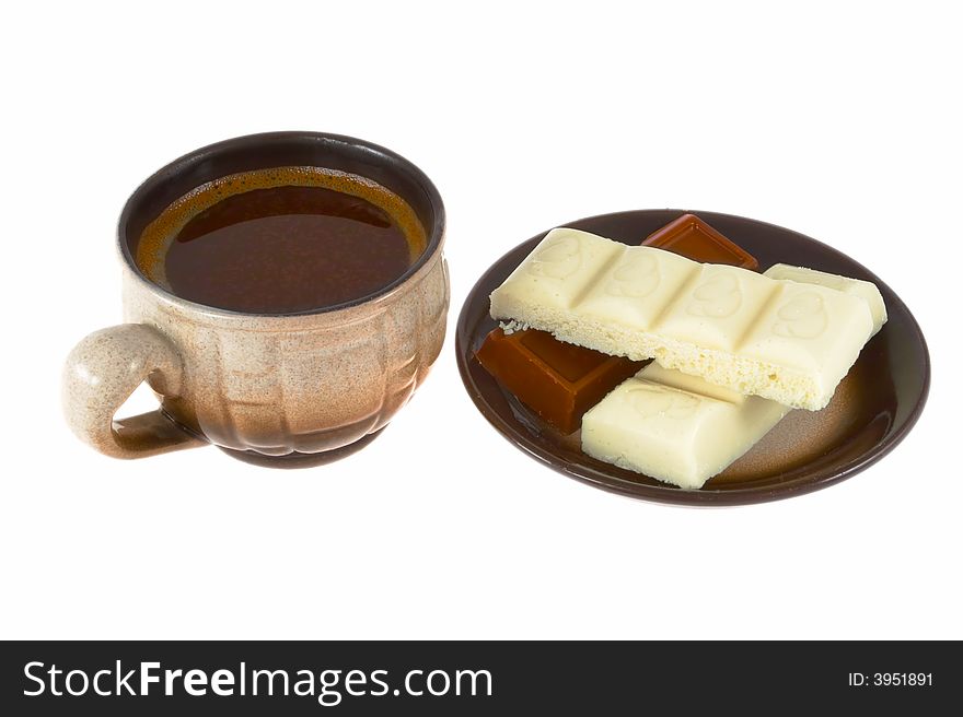 Black coffee with a piece of white and black chocolate. Black coffee with a piece of white and black chocolate