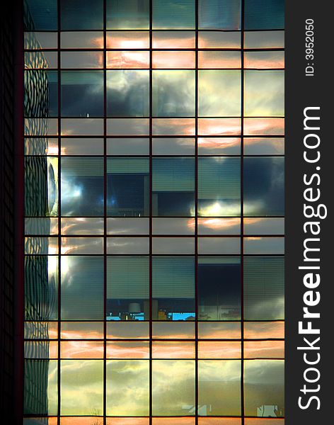 Clouds reflecting in windows of a dutch office-building. Clouds reflecting in windows of a dutch office-building