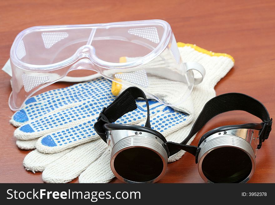 Safety glasses and gloves, background
