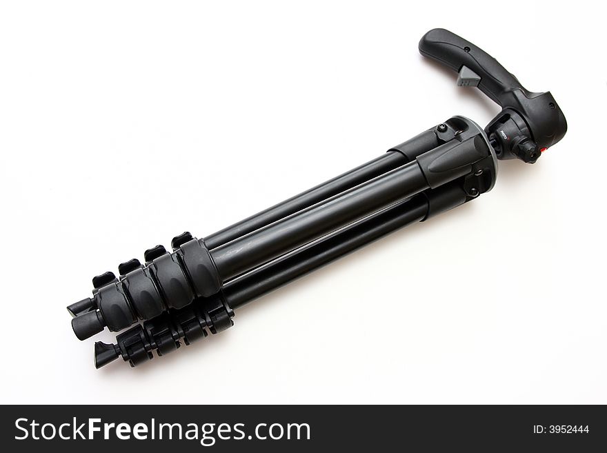 Black tripod over isolated on a white background.