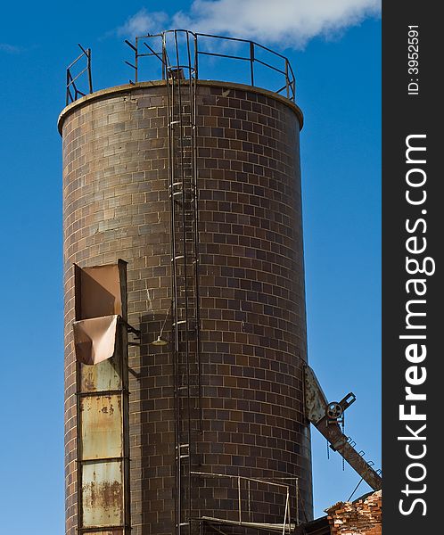 A brick tower for an abandoned electric plant in Walsenburg, Colorado with a very blue sky. A brick tower for an abandoned electric plant in Walsenburg, Colorado with a very blue sky.