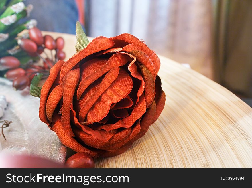 Artificial red rose at straw hat. Artificial red rose at straw hat