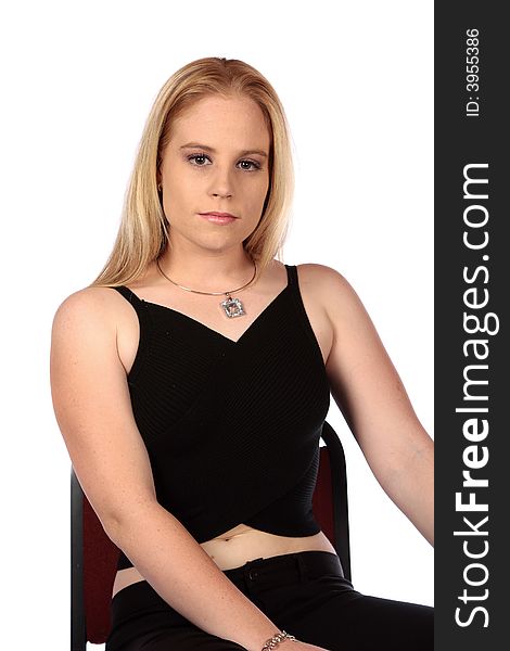 Model on chair looking serious at camera. Model on chair looking serious at camera