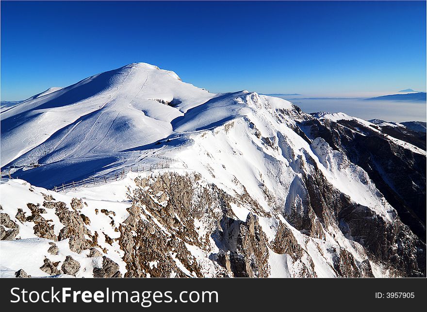 Majestic mountain peaks and ski slopes. Majestic mountain peaks and ski slopes