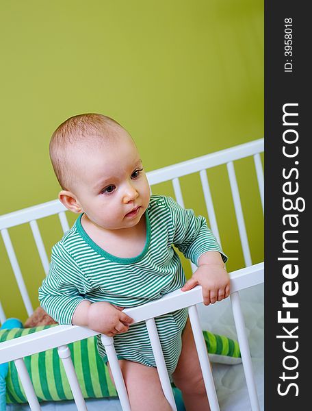 Portrait of little baby in crib