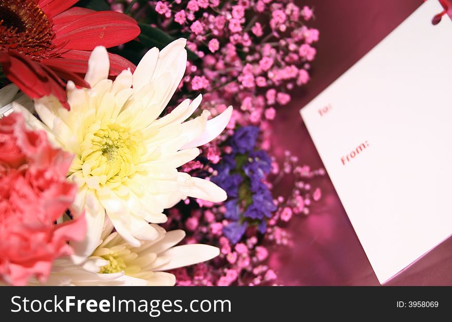 Blank gift card on a bouquet of flowers. Blank gift card on a bouquet of flowers