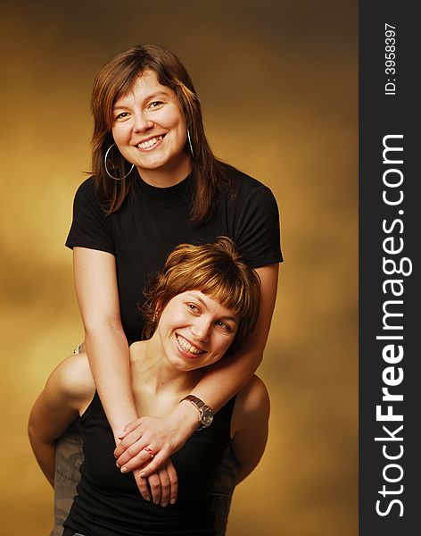 Smiling women over brown background. Smiling women over brown background