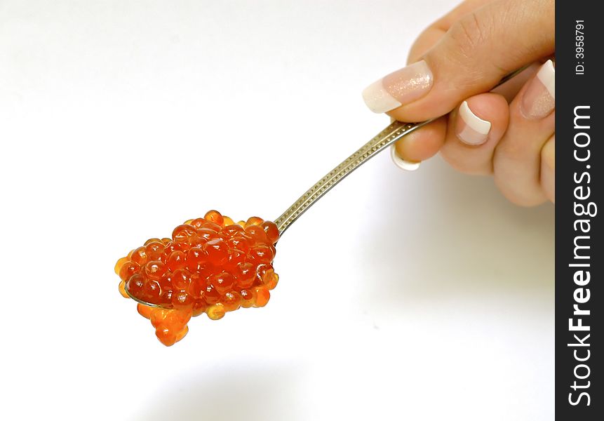 Fresh red caviar on the spoon