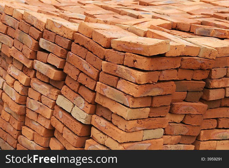 Handmade bricks ready for building