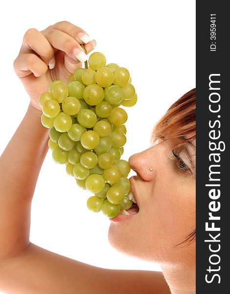 Girl with a cluster of green grapes, isolated on white