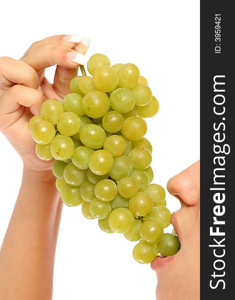 Girl with a cluster of green grapes, isolated on white