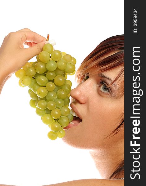 Girl with a cluster of green grapes, isolated on white