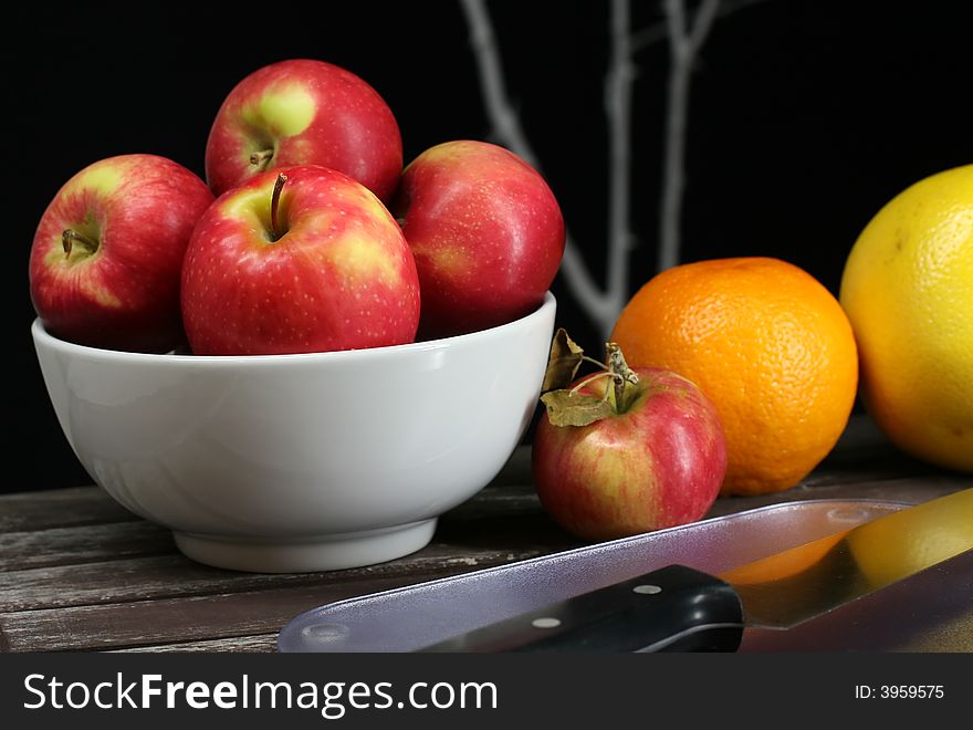 Apples, oranges, grapefruits, healthy fruit on a picnic table