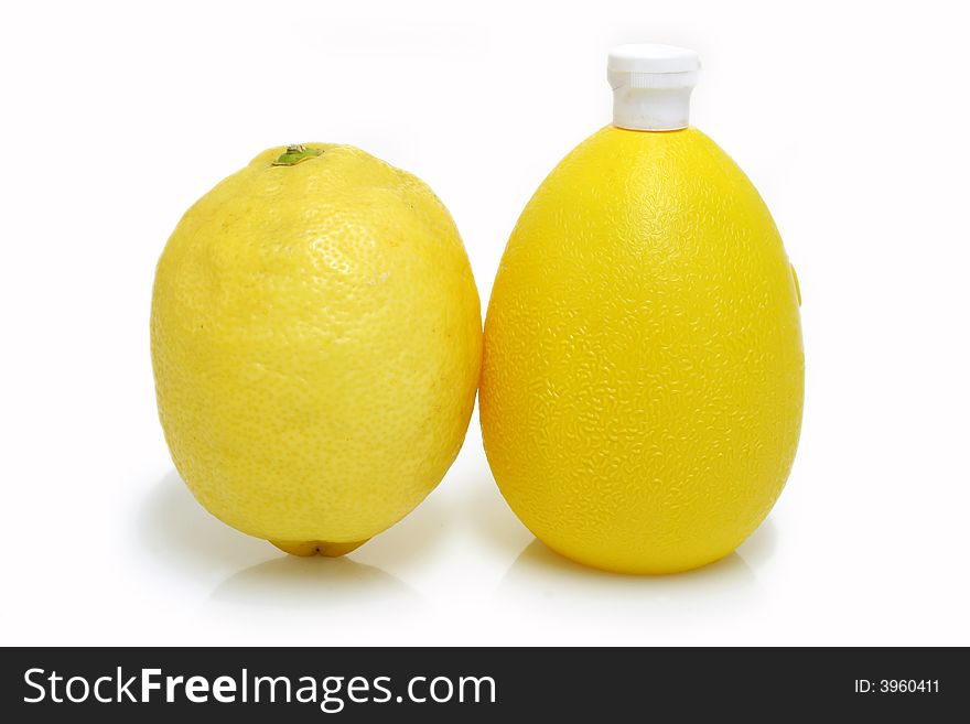 A Bottle Lemon concentrate on bright background. A Bottle Lemon concentrate on bright background