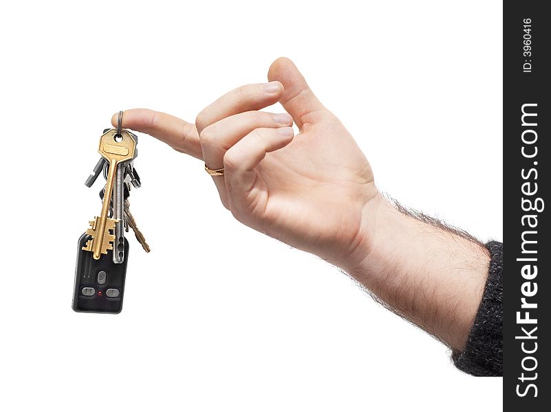 Man's hand holds bunch of keys and car remote, hanging on keyring. isolated on white. Man's hand holds bunch of keys and car remote, hanging on keyring. isolated on white