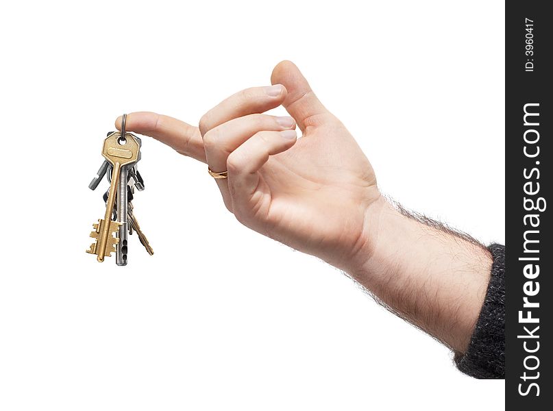 Man's hand holds bunch of keys, hanging on keyring. isolated on white. Man's hand holds bunch of keys, hanging on keyring. isolated on white